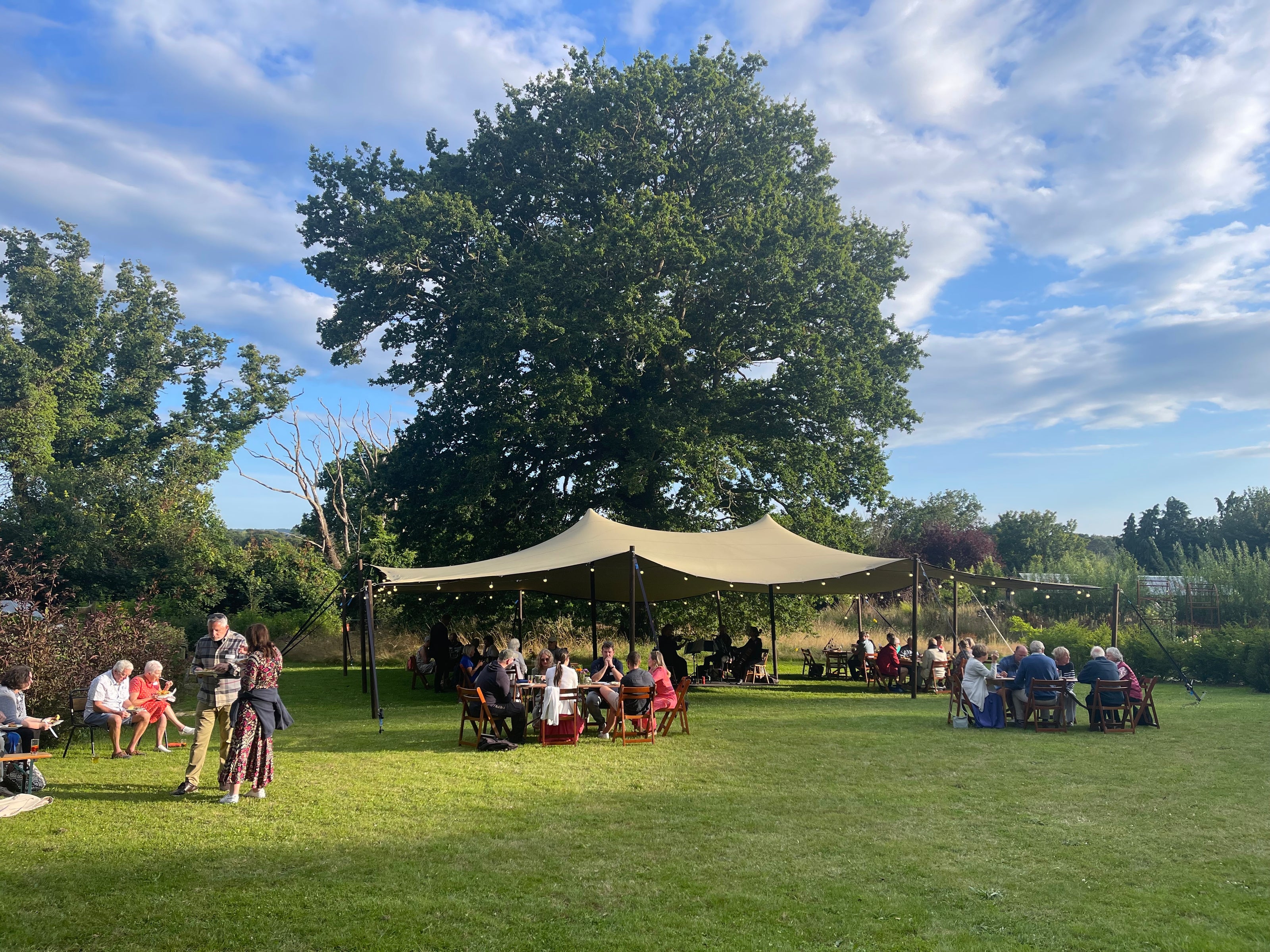 Private birthday party at Carey’s featuring a stretch tent, outdoor seating, and a beautiful natural setting, creating a relaxed and festive atmosphere for guests