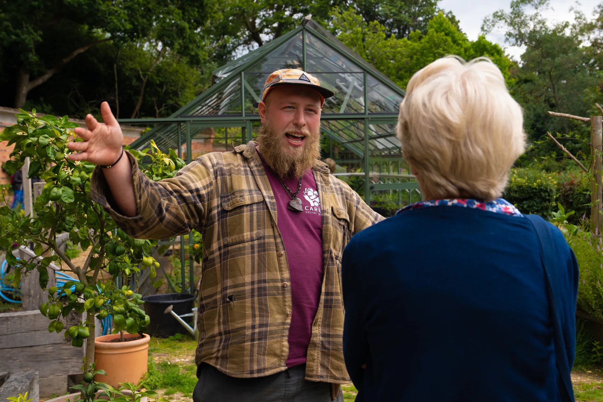 Image of Careys staff member talking to visitors during an Open Day. The team at Careys are super friendly and helpful. 