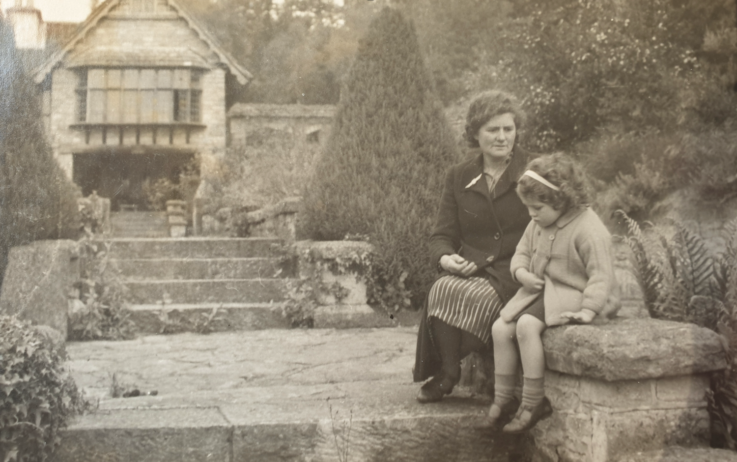 Old photo of Carey’s House showing a young girl who was evacuated there during the war, she returned in 2021 to see the newly opened gardens.