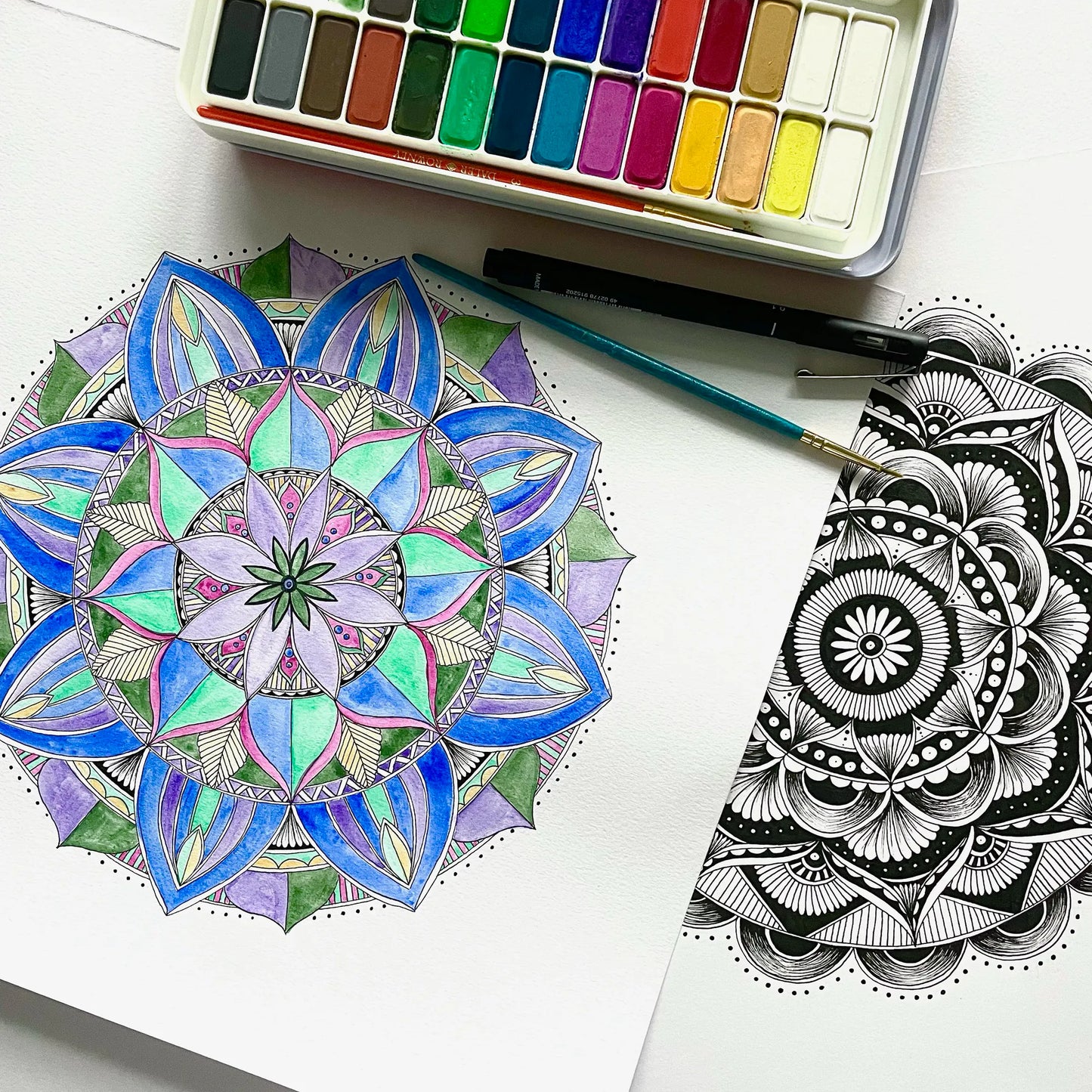 Hand-drawn mandalas created during a mindful workshop at Carey’s, showcasing intricate designs that promote relaxation, creativity, and focus in a peaceful, nature-inspired setting