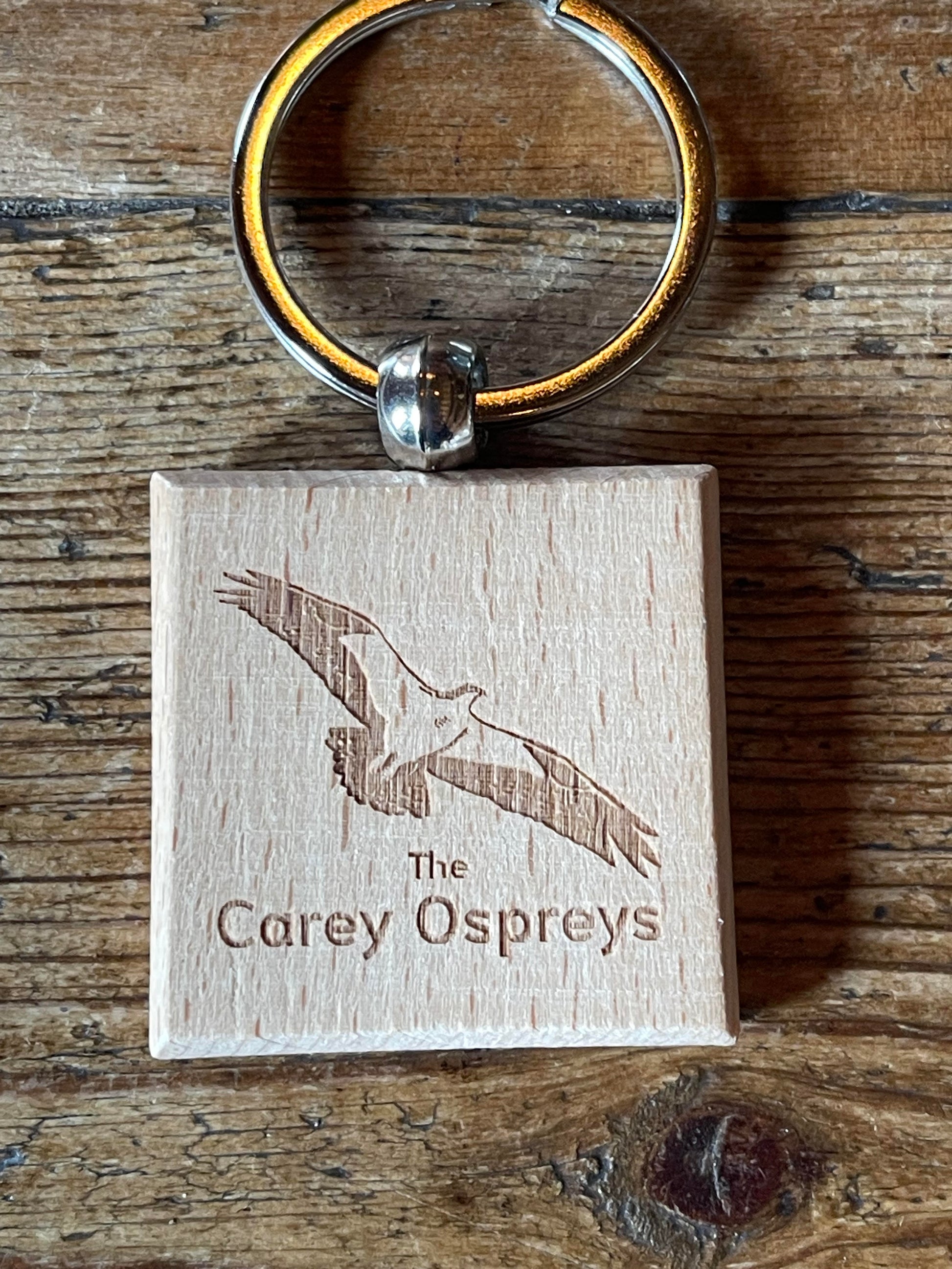 Wooden Carey Ospreys keyring featuring a laser-cut design of an osprey in flight, offering a nature-inspired keepsake from Careys Secret Garden