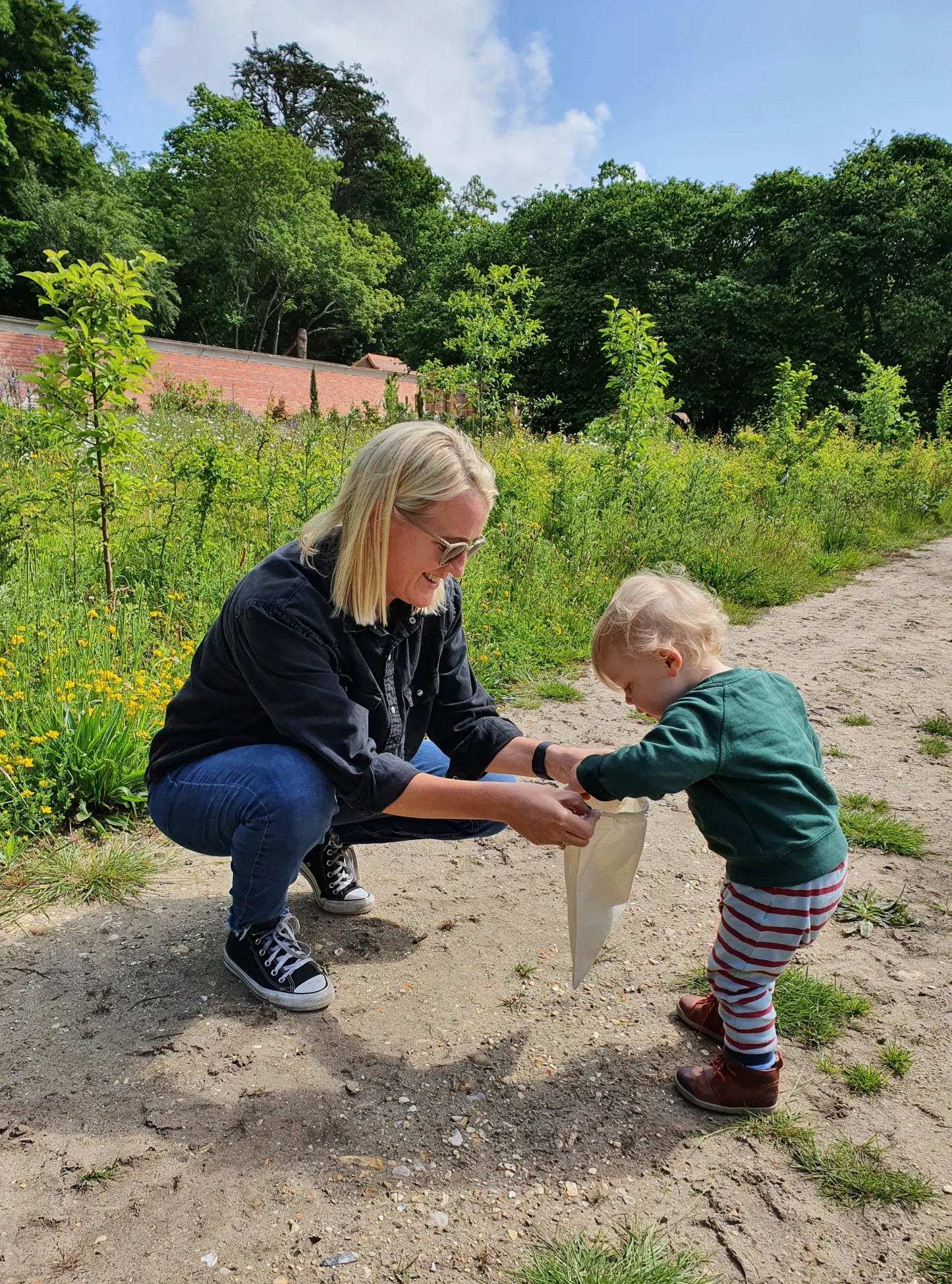 Weekly parent and toddler group at Carey’s, with parents and children engaging in nature-based activities, enjoying the outdoor space and fostering creativity and connection