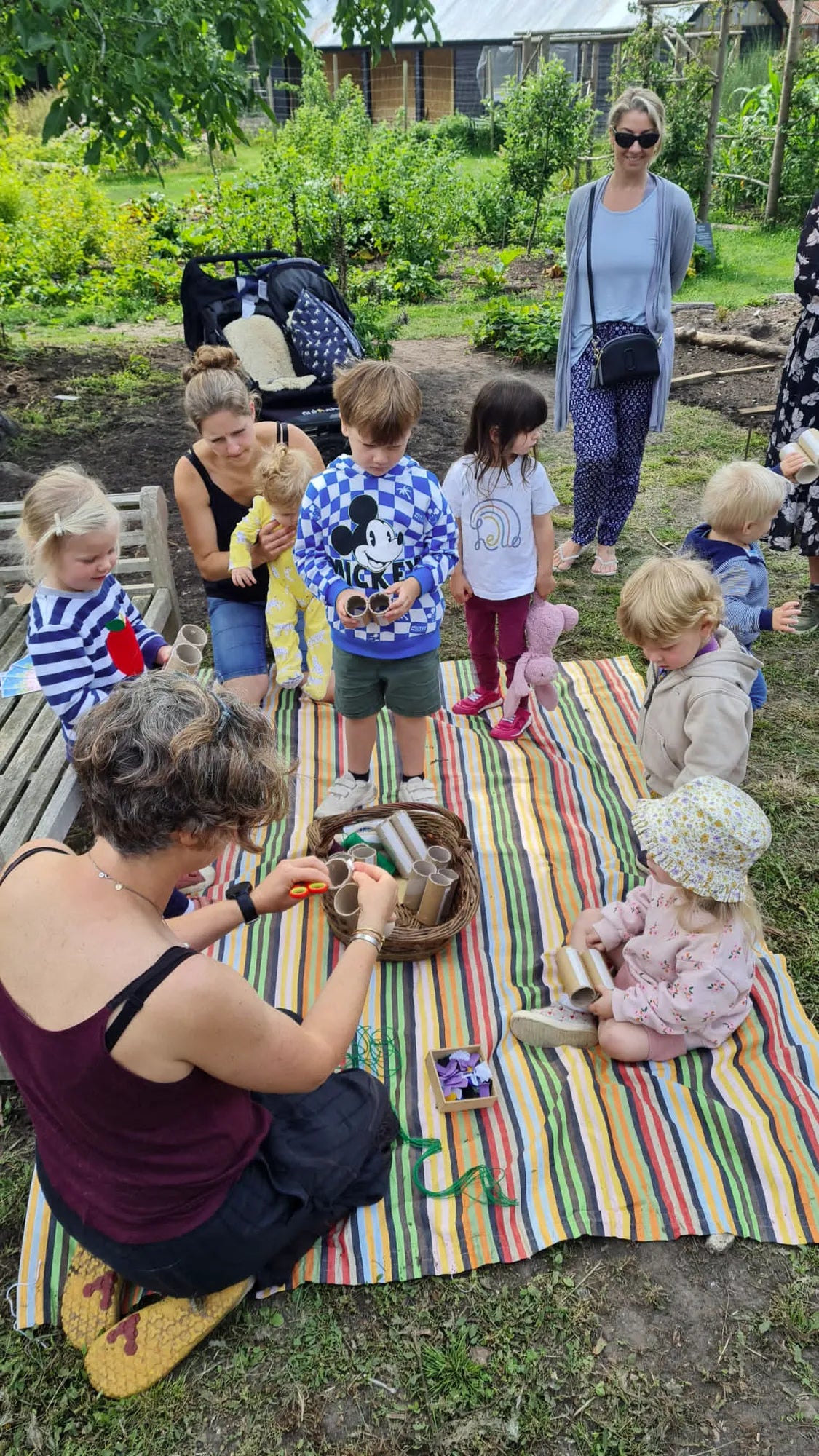 Weekly parent and toddler group at Carey’s, with parents and children engaging in nature-based activities, enjoying the outdoor space and fostering creativity and connection