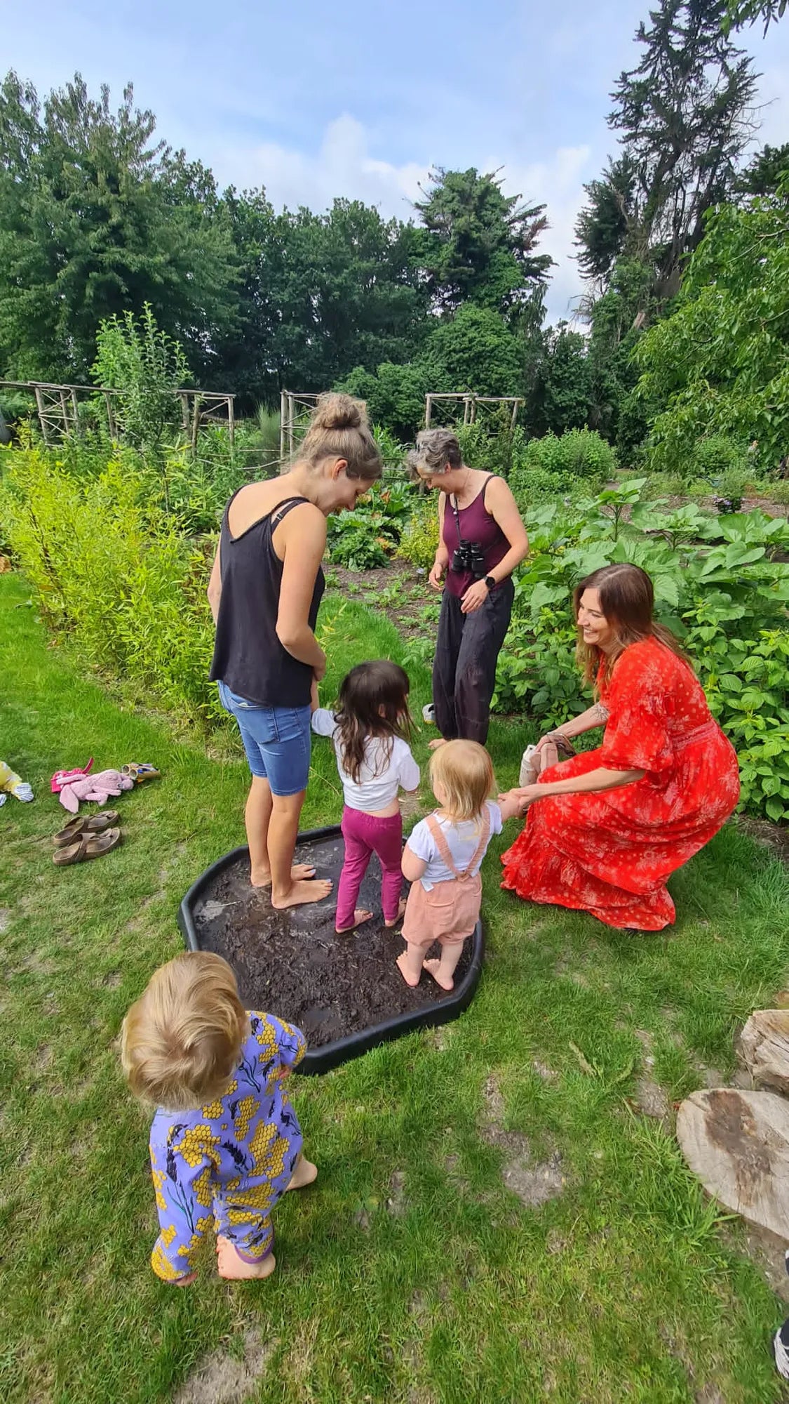 Weekly parent and toddler group at Carey’s, with parents and children engaging in nature-based activities, enjoying the outdoor space and fostering creativity and connection