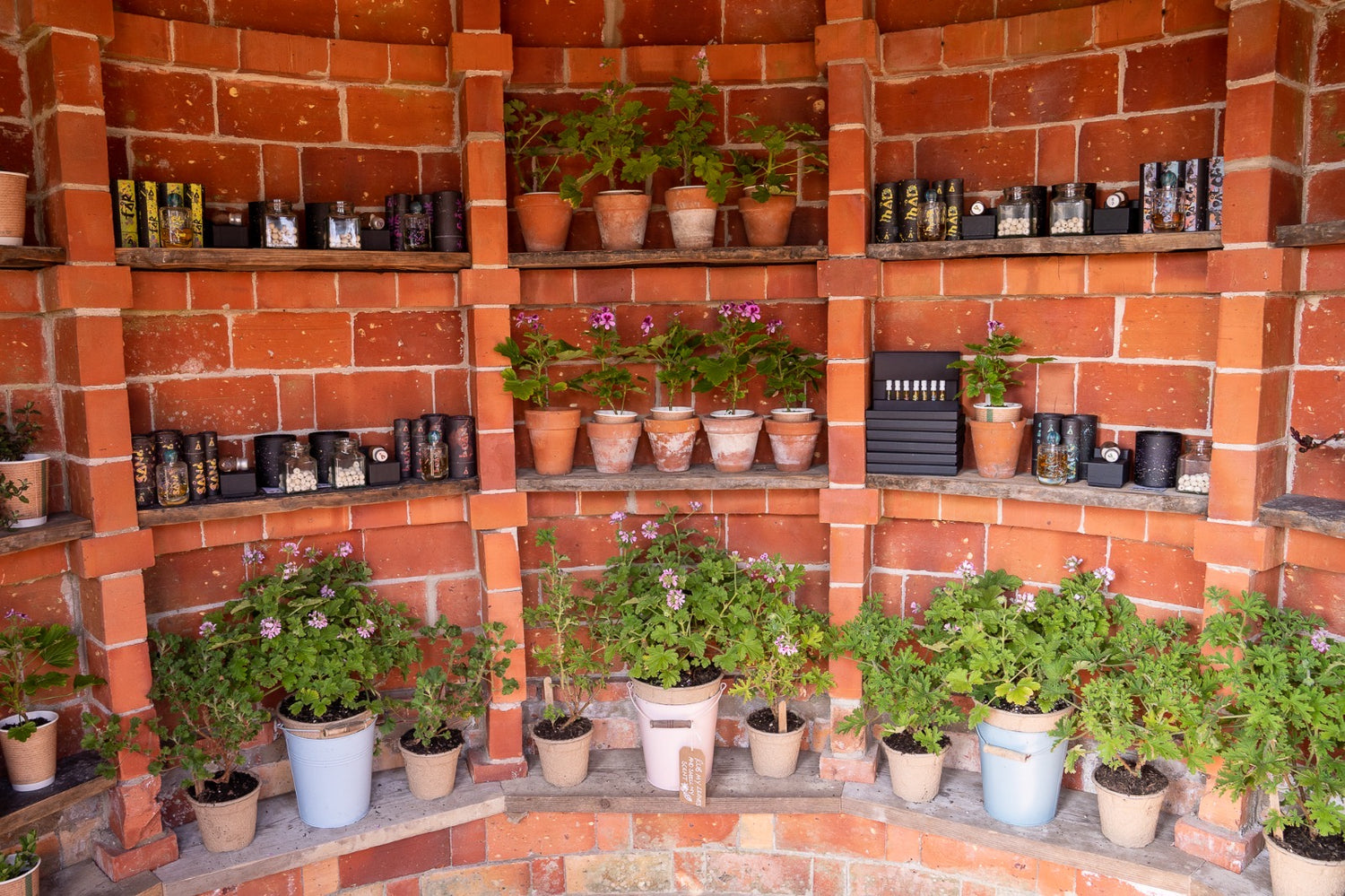 The Potting Shed at Carey’s, a charming round brick room with display shelves to showcase unique retail items, creating an interesting and inviting shopping experience