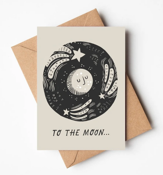 To The Moon’ greetings card by Lauren Marina featuring a beautiful monochrome design of the moon and stars